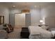 Stylish main bedroom features neutral tones, a patterned rug, and an elegant pendant light fixture at 1610 Brock Ct, Las Vegas, NV 89117