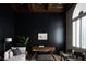 Stylish home office with dark walls, coffered ceilings, modern desk, and natural light at 1610 Brock Ct, Las Vegas, NV 89117