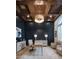 Sophisticated office featuring a coffered ceiling, statement lighting, and elegant decor at 1610 Brock Ct, Las Vegas, NV 89117