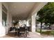Covered outdoor dining area with modern lighting and a view of the backyard at 1610 Brock Ct, Las Vegas, NV 89117