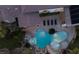 Aerial view of a stunning pool area with a lagoon-style pool, spa, and outdoor lounging at 1610 Brock Ct, Las Vegas, NV 89117