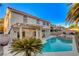 Inviting backyard pool and spa with covered patio, perfect for outdoor relaxation and entertaining at 1721 Sweet Pea Ave, Las Vegas, NV 89183