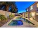 Stunning backyard showcasing a pool, spa, and covered patio, perfect for entertaining and enjoying outdoor living at 1721 Sweet Pea Ave, Las Vegas, NV 89183