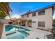 Gorgeous backyard featuring a sparkling pool, integrated hot tub, and lush landscaping, creating a serene oasis at 1721 Sweet Pea Ave, Las Vegas, NV 89183