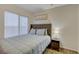 This bedroom features a large window, and cozy decor at 1721 Sweet Pea Ave, Las Vegas, NV 89183