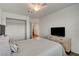 Nicely appointed bedroom with wood-look floors, closet and a ceiling fan at 1721 Sweet Pea Ave, Las Vegas, NV 89183