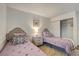 Charming bedroom featuring two twin beds, closet and a nightstand with lamp at 1721 Sweet Pea Ave, Las Vegas, NV 89183