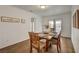 Dining room with a wooden table, seating for six, and access to the backyard at 1721 Sweet Pea Ave, Las Vegas, NV 89183