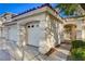 Attached three car garage with front yard landscaping in front of this single story home at 1721 Sweet Pea Ave, Las Vegas, NV 89183