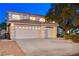 Charming two-story home with a three-car garage, well-maintained landscaping, and inviting curb appeal at 1721 Sweet Pea Ave, Las Vegas, NV 89183