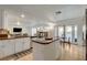 Open kitchen with stainless appliances and breakfast bar seamlessly connects to living and outdoor spaces at 1721 Sweet Pea Ave, Las Vegas, NV 89183