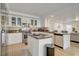 Bright kitchen with white cabinets, stainless steel appliances, and an island with bar seating at 1721 Sweet Pea Ave, Las Vegas, NV 89183
