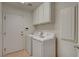 Functional laundry room with appliances and storage at 1721 Sweet Pea Ave, Las Vegas, NV 89183