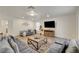 Spacious living room with large sectional sofa, accent rug, and modern decor at 1721 Sweet Pea Ave, Las Vegas, NV 89183