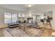 Open living room integrates fireplace, view of the outdoor scenery, and comfortable seating at 1721 Sweet Pea Ave, Las Vegas, NV 89183