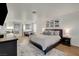 Expansive main bedroom offering hardwood floors, sitting area, and king-size bed at 1721 Sweet Pea Ave, Las Vegas, NV 89183