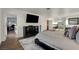Large main bedroom including hardwood floors, entertainment center, and an open layout at 1721 Sweet Pea Ave, Las Vegas, NV 89183