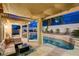 Relaxing covered patio overlooking the pool and spa offers an inviting outdoor living space at 1721 Sweet Pea Ave, Las Vegas, NV 89183
