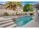 Beautiful backyard pool and spa with palm trees, offering a serene and private outdoor living space at 1721 Sweet Pea Ave, Las Vegas, NV 89183