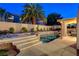 Backyard pool and spa area with lush palm trees, offering a private oasis for relaxation and enjoyment at 1721 Sweet Pea Ave, Las Vegas, NV 89183