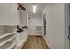 Organized walk-in closet with custom shelving and wood-look flooring, providing ample storage space at 1721 Sweet Pea Ave, Las Vegas, NV 89183