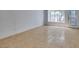 Finished basement area featuring neutral tile flooring, large window, and access to the backyard at 1806 Renada Cir, North Las Vegas, NV 89030