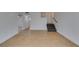 Finished basement area featuring neutral tile flooring, ceiling fan, and staircase at 1806 Renada Cir, North Las Vegas, NV 89030