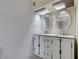Bathroom featuring a double sink vanity with granite countertop and white cabinets at 1806 Renada Cir, North Las Vegas, NV 89030