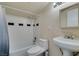 Cozy bathroom featuring a bathtub, shower, sink, and toilet, ready for personalization at 1806 Renada Cir, North Las Vegas, NV 89030