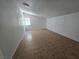 Empty room with tile floors and a small window giving natural light at 1806 Renada Cir, North Las Vegas, NV 89030