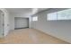 Cozy bedroom featuring neutral walls, tile floors, and natural light at 1806 Renada Cir, North Las Vegas, NV 89030
