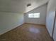 Cozy bedroom with tile flooring and window offering natural light at 1806 Renada Cir, North Las Vegas, NV 89030