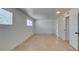 Inviting bedroom with two windows, neutral walls, and tile flooring at 1806 Renada Cir, North Las Vegas, NV 89030