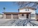 Two story home with a two car garage and covered front entryway at 1806 Renada Cir, North Las Vegas, NV 89030