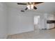 This kitchen features neutral tile flooring and black appliances at 1806 Renada Cir, North Las Vegas, NV 89030