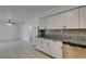 This kitchen features granite countertops, stainless steel appliances, and tile flooring at 1806 Renada Cir, North Las Vegas, NV 89030