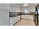 This kitchen features granite countertops, updated appliances, and white cabinets at 1806 Renada Cir, North Las Vegas, NV 89030