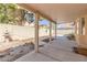 Covered patio provides shade and comfort in the expansive backyard with decorative elements at 1904 Imola Ct, Las Vegas, NV 89123