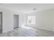 This bedroom offers spacious closet, wood-look flooring and a window with natural light at 1904 Imola Ct, Las Vegas, NV 89123