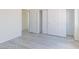 Spacious bedroom boasts wood-look flooring, a large closet, and ample natural light at 1904 Imola Ct, Las Vegas, NV 89123