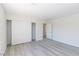 Bedroom with wood-look floors and a closet with sliding doors at 1904 Imola Ct, Las Vegas, NV 89123