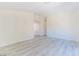 The living room has light colored wood floors and plenty of natural light at 1904 Imola Ct, Las Vegas, NV 89123