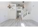 Open living room featuring a staircase and light gray vinyl floors at 1904 Imola Ct, Las Vegas, NV 89123