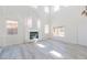 Two-story living room with fireplace and light gray vinyl floors at 1904 Imola Ct, Las Vegas, NV 89123