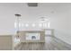 Bright loft area with wood-look flooring and a view of the living room fireplace at 1904 Imola Ct, Las Vegas, NV 89123