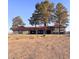 Spacious single-story home with red tile roof, gray exterior, and large bare front yard at 1967 N Moapa Valley Blvd, Logandale, NV 89021