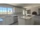 Modern kitchen featuring marble countertops, stainless steel appliances, and an island cooktop at 1967 N Moapa Valley Blvd, Logandale, NV 89021