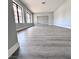 Spacious living room featuring gorgeous floors and natural light from large windows at 1967 N Moapa Valley Blvd, Logandale, NV 89021