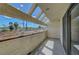 Cozy balcony featuring a view of a local street and framed by a unique pergola design at 2080 Karen Ave # 12, Las Vegas, NV 89169