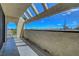 Balcony view framed by modern pergola, with picturesque view of blue skies and desert landscape at 2080 Karen Ave # 12, Las Vegas, NV 89169
